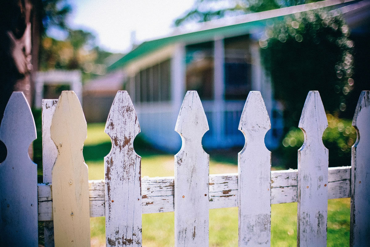 old worn white fence